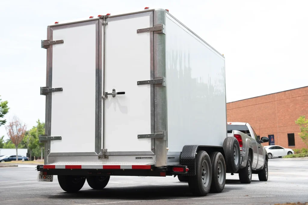 Rear View of an omnichill™ Refrigerated Trailer attached to a Pickup Truck